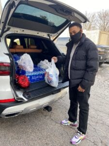 Bernard Ellis at the back of his car, dropping off a donation at the ACTC center in Towson